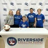 (submitted photo)
Surrounded by his family Josiah Sundby signed his Letter of Intent to continue his athletic career at Manville State University.